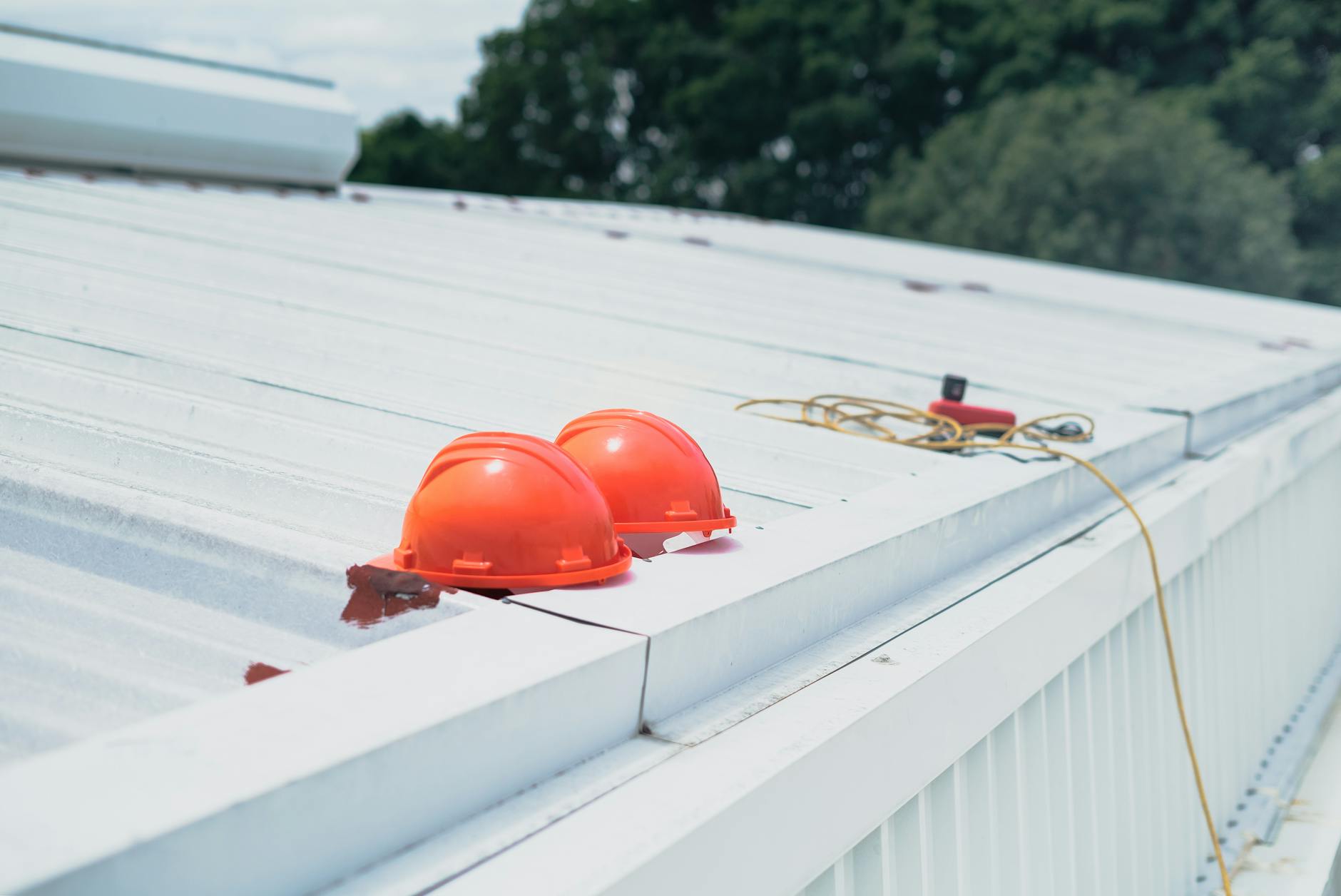 Roofer carrying out a rooftop health-check inspection